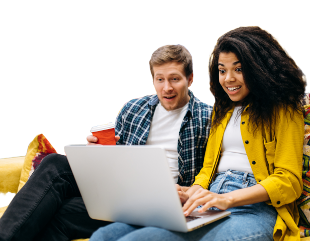 couple looking enthralled by a laptop